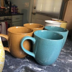 Two blue two brown coffee mugs